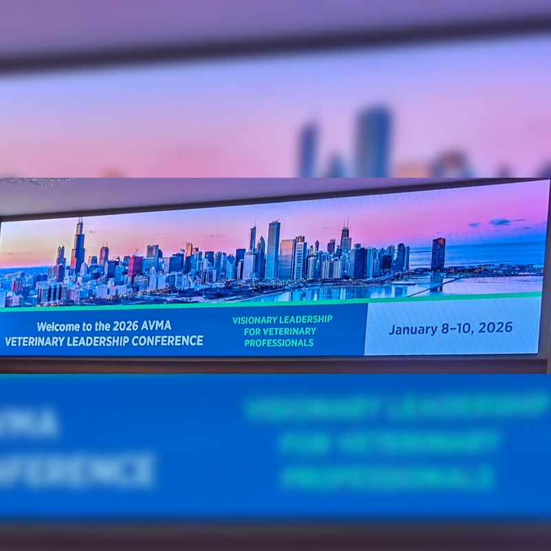 A conference banner displays a city skyline with text: "Welcome to the 2026 AVMA Veterinary Leadership Conference," "Visionary Leadership for Veterinary Professionals," and "January 8–10, 2026.