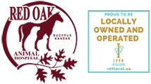 Logo for Red Oak Animal Hospital with a horse silhouette and oak leaves, alongside a sign stating "Proud to be Locally Owned and Operated" with the vetlocal.us website and a veterinary caduceus symbol.
